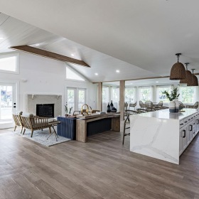 a clubroom with a kitchen area and a lounge area