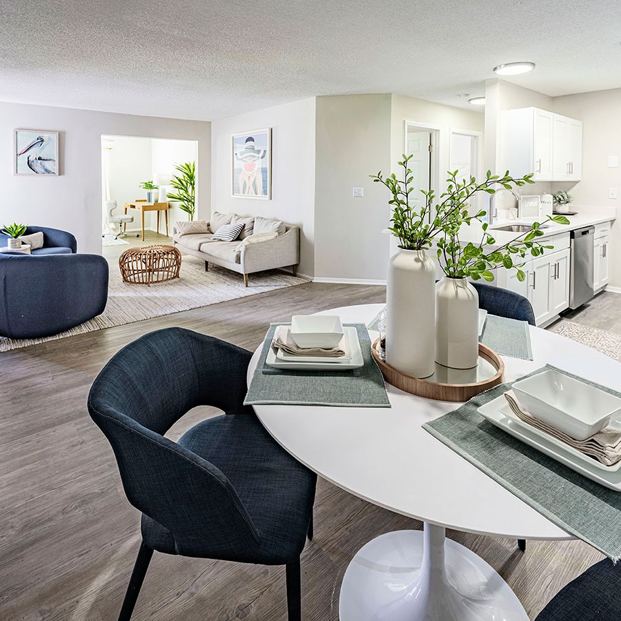 a kitchen with a dining table and chairs