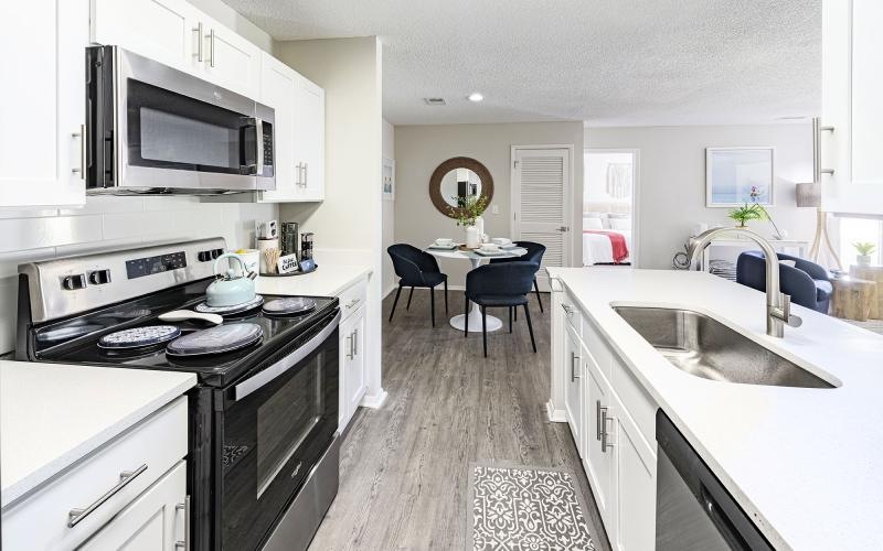 a kitchen with a sink and a stove
